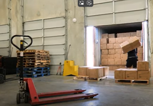 Unloading container load of cabinets with pallet jack